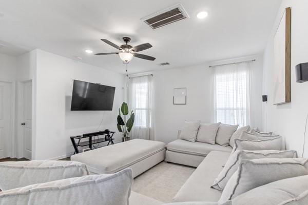 living room featuring ceiling fan