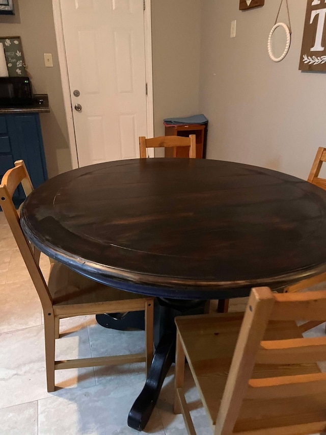 view of tiled dining space