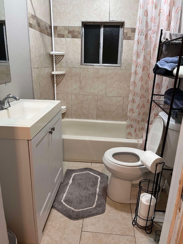 full bathroom with tile patterned flooring, vanity, shower / bath combo, and toilet