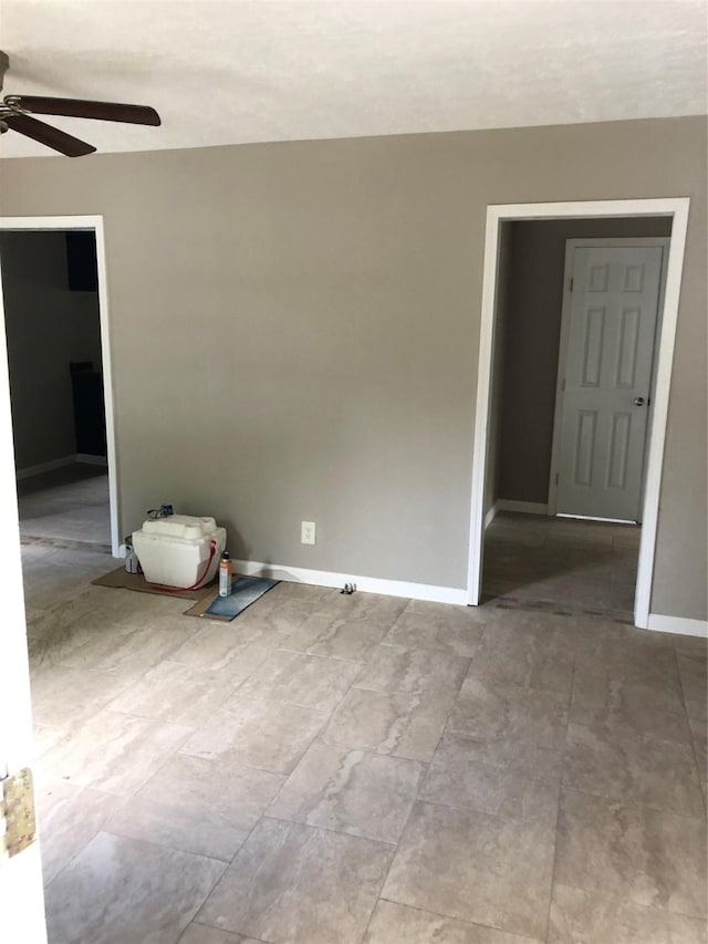 unfurnished room featuring ceiling fan