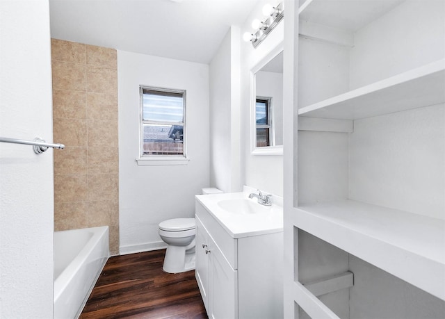 bathroom with vanity, wood-type flooring, and toilet