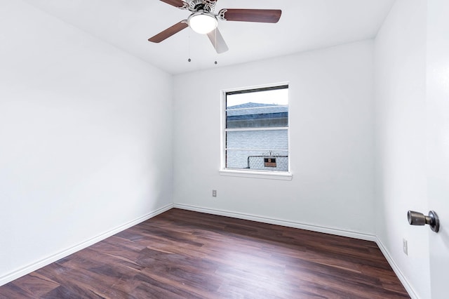 unfurnished room featuring dark hardwood / wood-style floors and ceiling fan