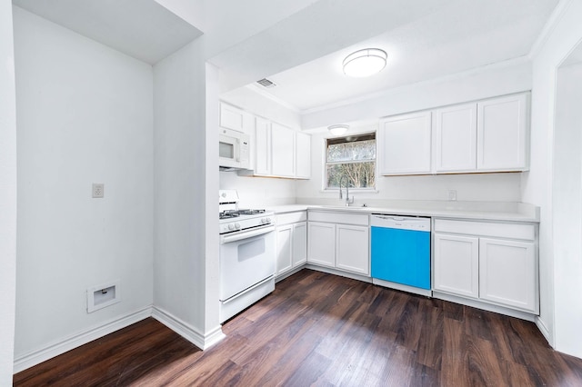 kitchen featuring white appliances, white cabinets, crown molding, sink, and dark hardwood / wood-style floors