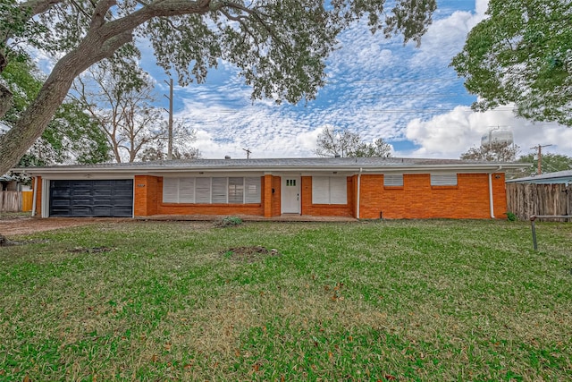 ranch-style home with a garage and a front yard