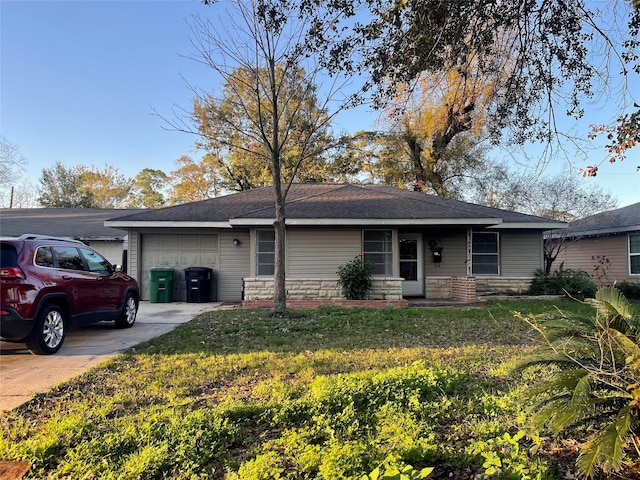 ranch-style house with a front yard and a garage