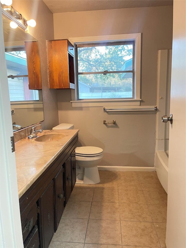 bathroom with tile patterned floors, vanity, and toilet