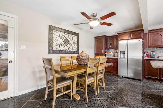 dining room featuring ceiling fan