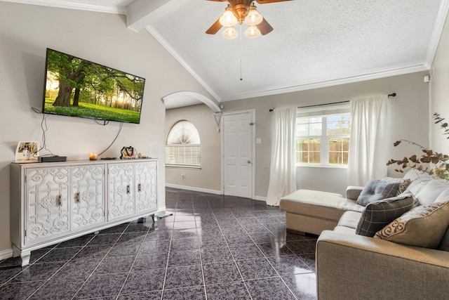 living room with a textured ceiling, vaulted ceiling with beams, ceiling fan, and crown molding