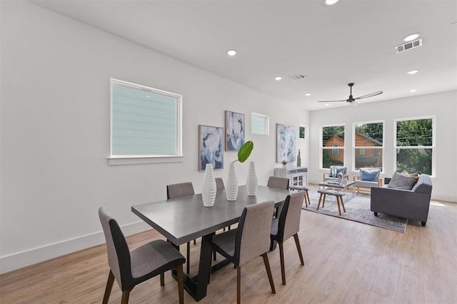 dining space featuring ceiling fan and light hardwood / wood-style floors