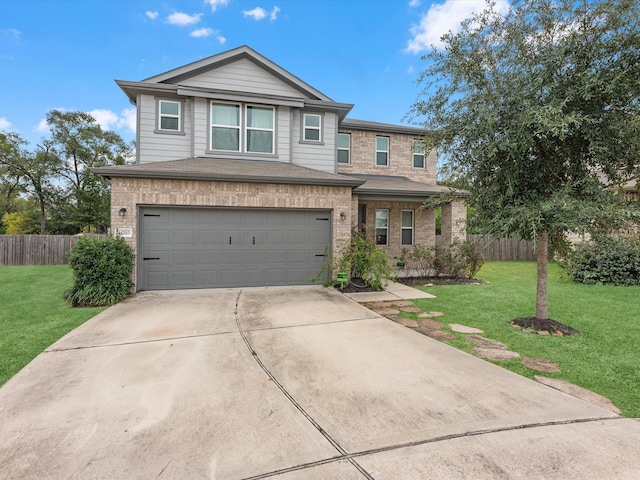 view of front of home with a garage and a front yard