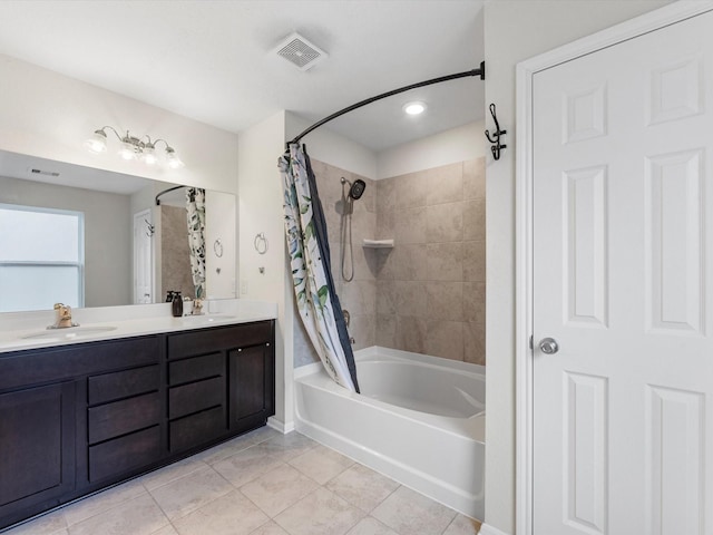 bathroom featuring tile patterned floors, vanity, and shower / tub combo