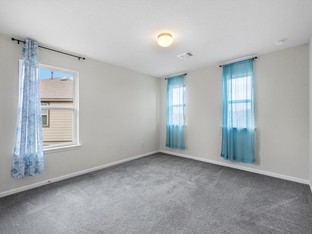 empty room featuring carpet floors