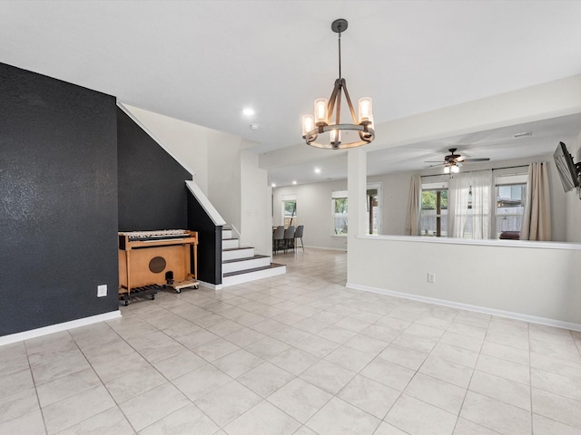 unfurnished living room with light tile patterned floors and ceiling fan with notable chandelier