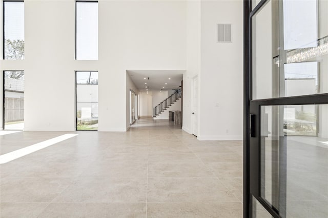 entryway featuring a high ceiling