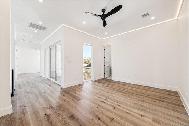 empty room with light hardwood / wood-style floors, ceiling fan, and crown molding