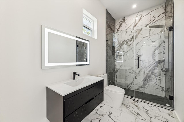 bathroom with vanity, toilet, and a shower with door