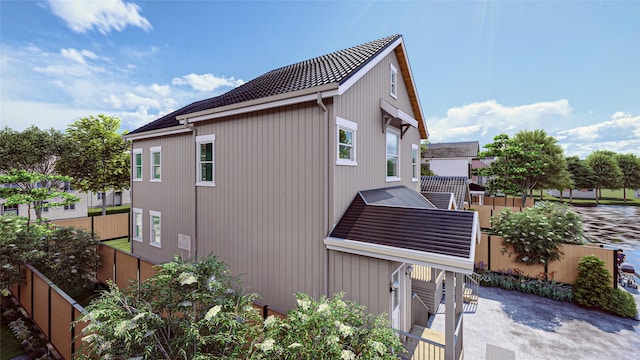 view of side of property featuring a patio area