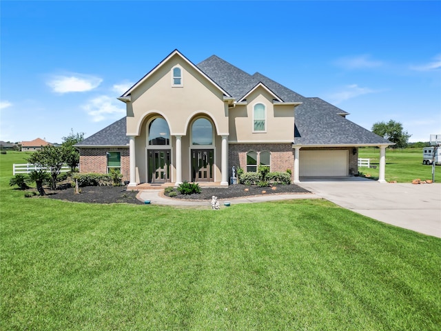 view of front of house featuring a front lawn, a porch, and a garage