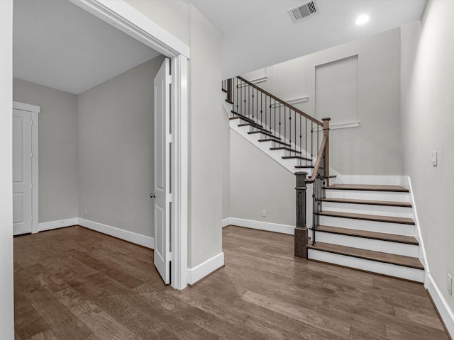 stairs with wood-type flooring