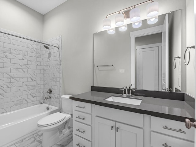 full bathroom with vanity, tiled shower / bath combo, and toilet