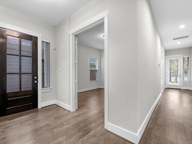 foyer entrance with light hardwood / wood-style flooring