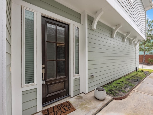 property entrance featuring covered porch