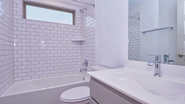 full bathroom featuring vanity, toilet, and tiled shower / bath