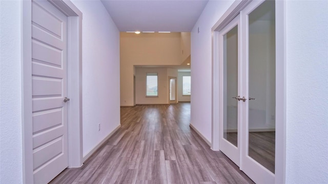 corridor featuring light wood-type flooring