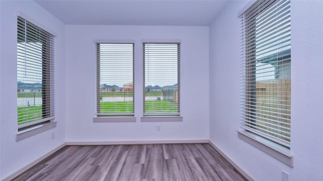 spare room with light wood-type flooring