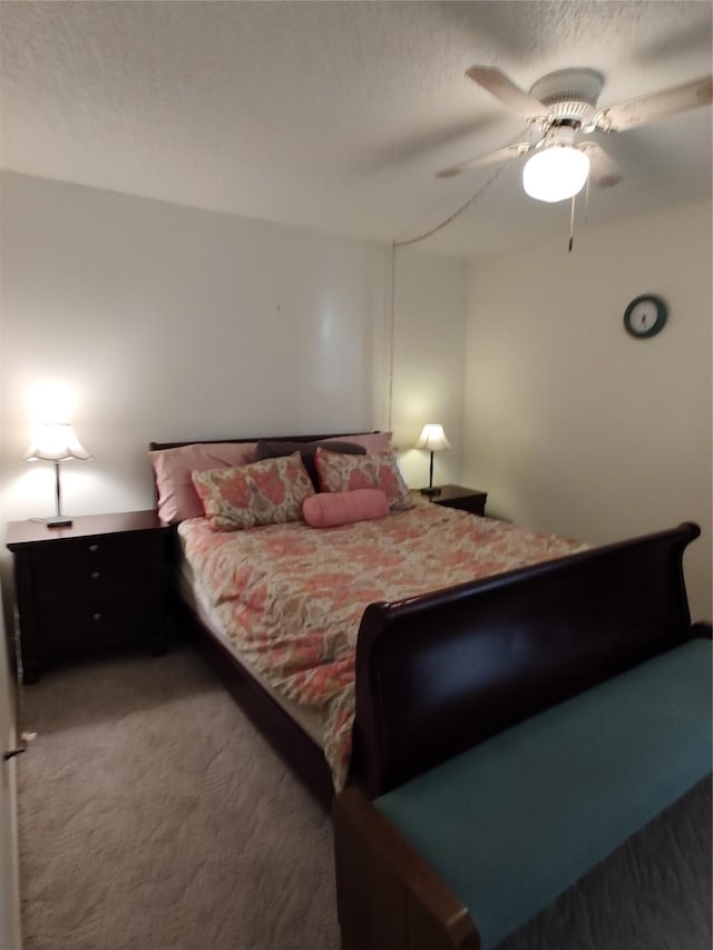 bedroom featuring ceiling fan and carpet floors