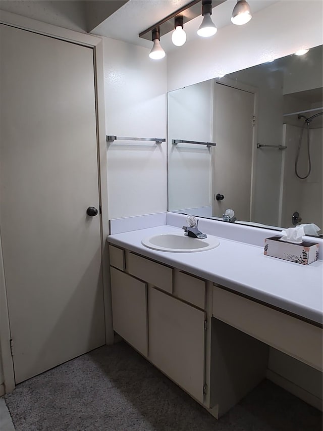 bathroom featuring vanity and walk in shower