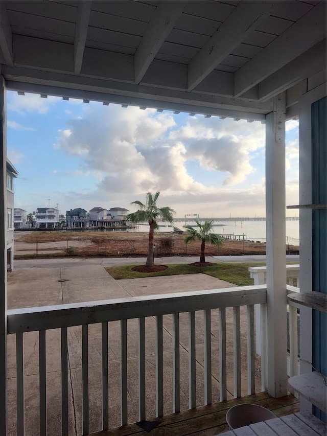 wooden terrace with a water view