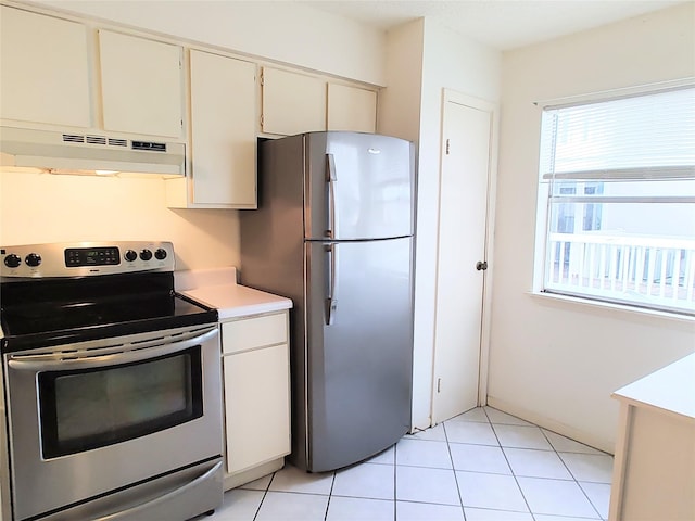 kitchen with white cabinetry, light tile patterned floors, and stainless steel appliances