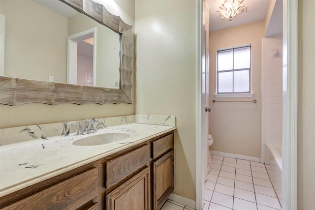 full bathroom featuring tile patterned flooring, vanity, toilet, and washtub / shower combination