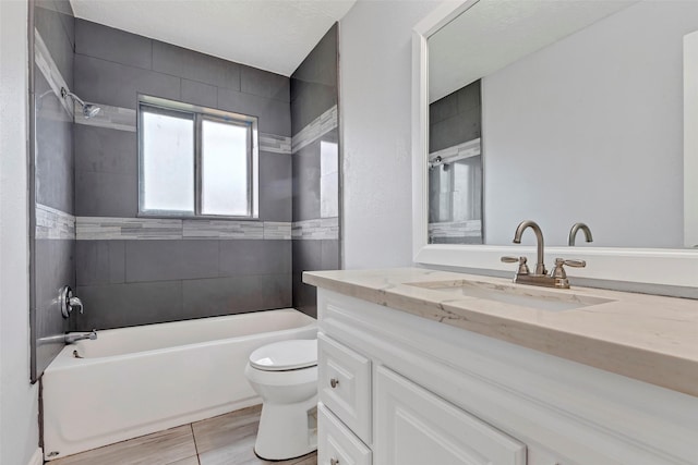 full bath featuring vanity, toilet, and washtub / shower combination