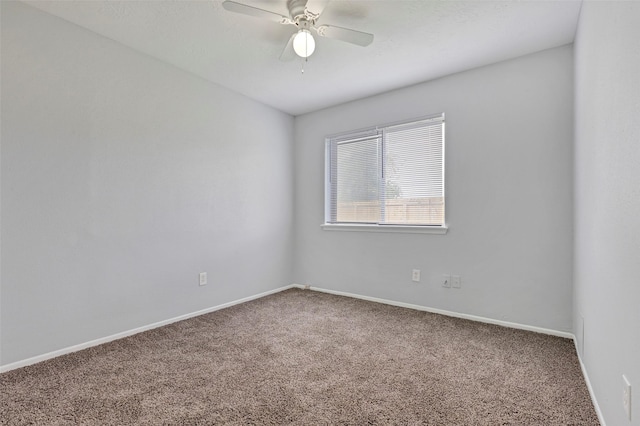 unfurnished room with baseboards, ceiling fan, and carpet floors