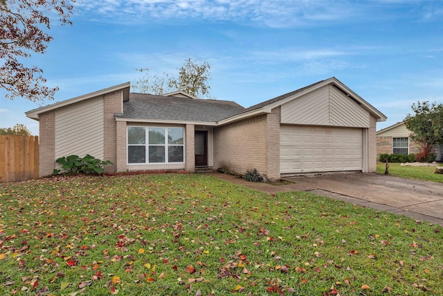 mid-century home featuring fence, driveway, an attached garage, a front lawn, and brick siding