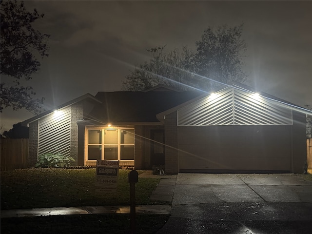 mid-century inspired home with an attached garage