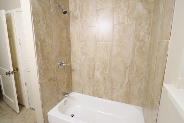 bathroom with tile patterned flooring and tiled shower / bath