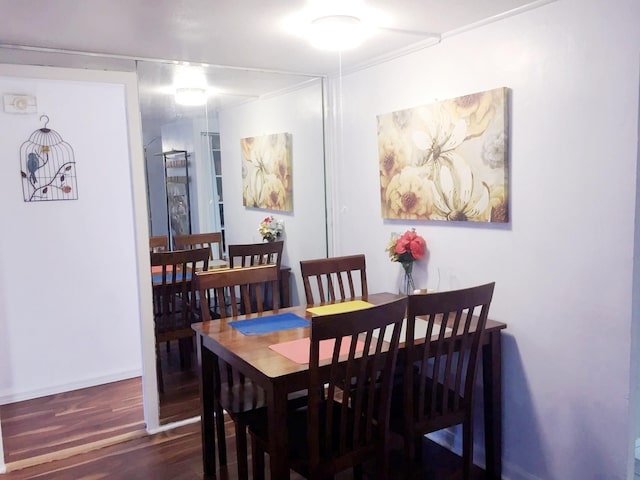 dining room with dark hardwood / wood-style floors