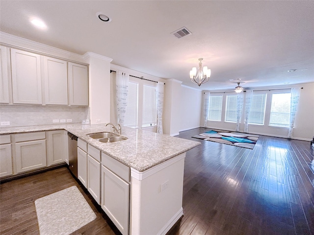 kitchen with decorative light fixtures, white cabinetry, sink, and dark wood-type flooring