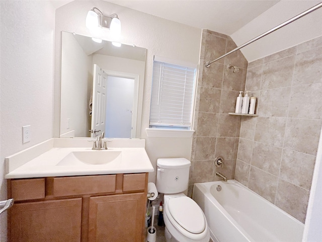 full bathroom featuring vanity, tiled shower / bath combo, toilet, and vaulted ceiling