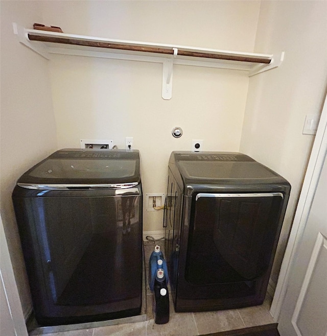 laundry room with separate washer and dryer