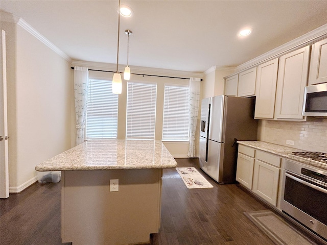 kitchen with crown molding, dark hardwood / wood-style floors, decorative light fixtures, light stone counters, and stainless steel appliances