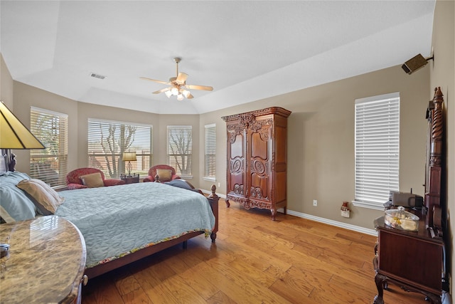 bedroom with ceiling fan and light hardwood / wood-style floors