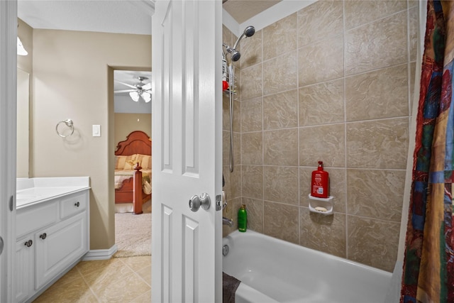 bathroom featuring ceiling fan, tile patterned flooring, vanity, and shower / tub combo