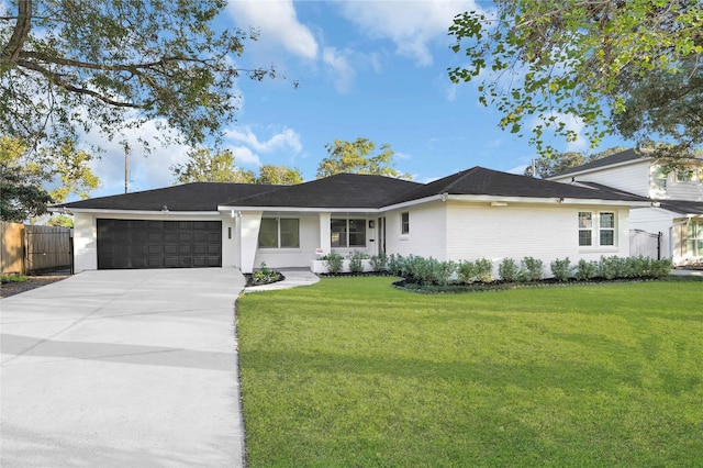 ranch-style house with a front yard and a garage