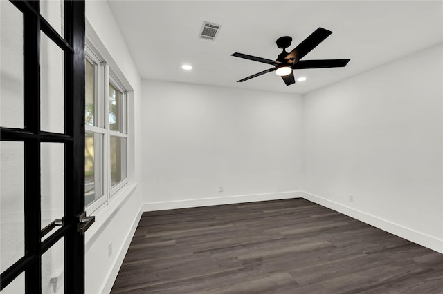 unfurnished room with ceiling fan and dark hardwood / wood-style floors