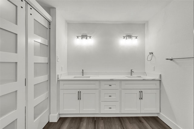 bathroom featuring hardwood / wood-style floors and vanity