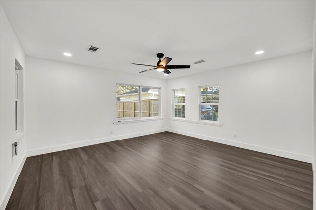 unfurnished room featuring dark hardwood / wood-style flooring and ceiling fan